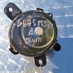 Front view of a white Opel Corsa E car parked outdoors with clear sunlight and shadows visible.Front view of a