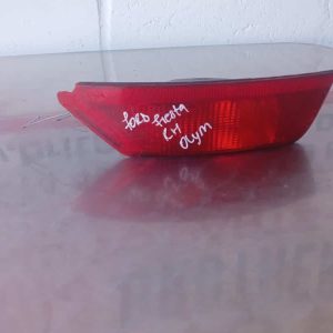 Rear bumper reflector for Ford Fiesta shown from side angle, clean surface visible.Rear bumper reflector for F