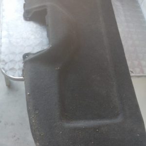 Rear back board of a 2008 Nissan Tiida shown from angled top view, used condition visible.Rear back board of a