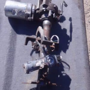 Used electric steering column for Nissan Micra, angled view showing wiring and mounting points.Used electric s