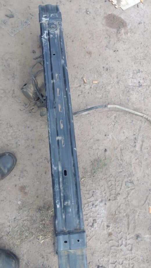 Rear stiffener for Ford Kuga shown from top angle, used condition with mounting points visible.Rear stiffener