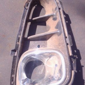 Left front spotlight cover for Kia Picanto, shown from angled front view, used condition.Left front spotlight