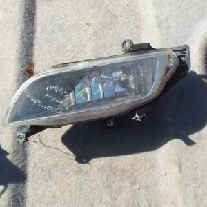 Left headlight assembly for Hyundai H1, angled view, used condition.Left headlight assembly for Hyundai H1, an