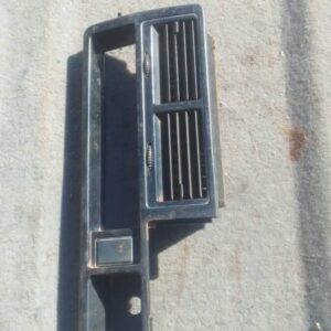 Front view of a used centre dash air vent for Mazda 323, showing horizontal and vertical slats in black plasti
